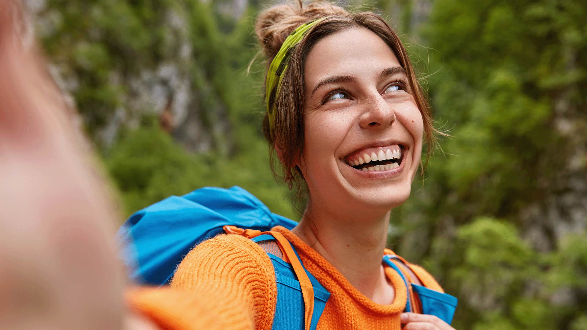happy woman taking a selfie outdoors