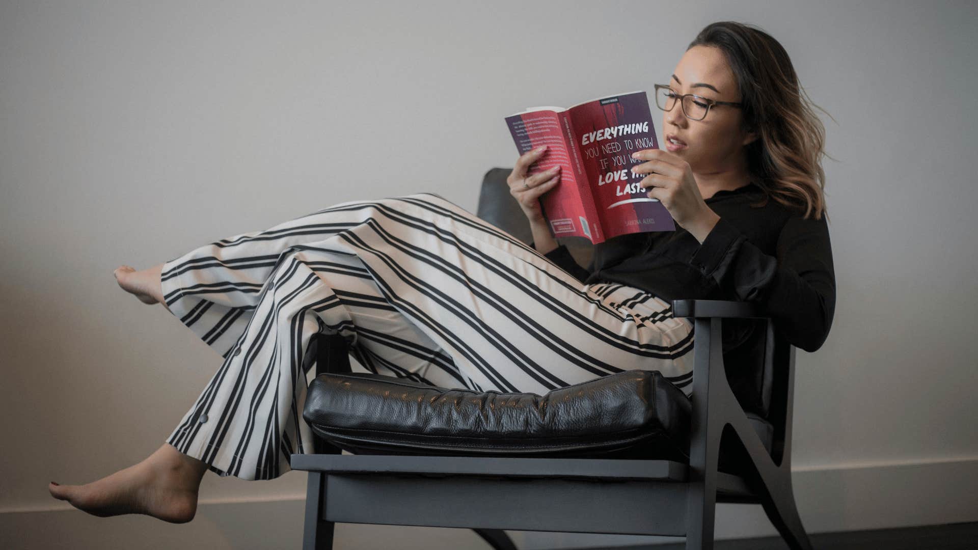 woman reading relationship book