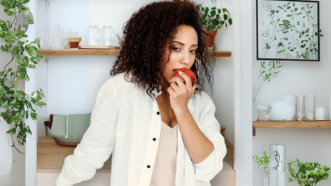 If You Want More Self-Confidence, It's Time To Accept These Three Essential Truths Confident healthy woman eating an apple