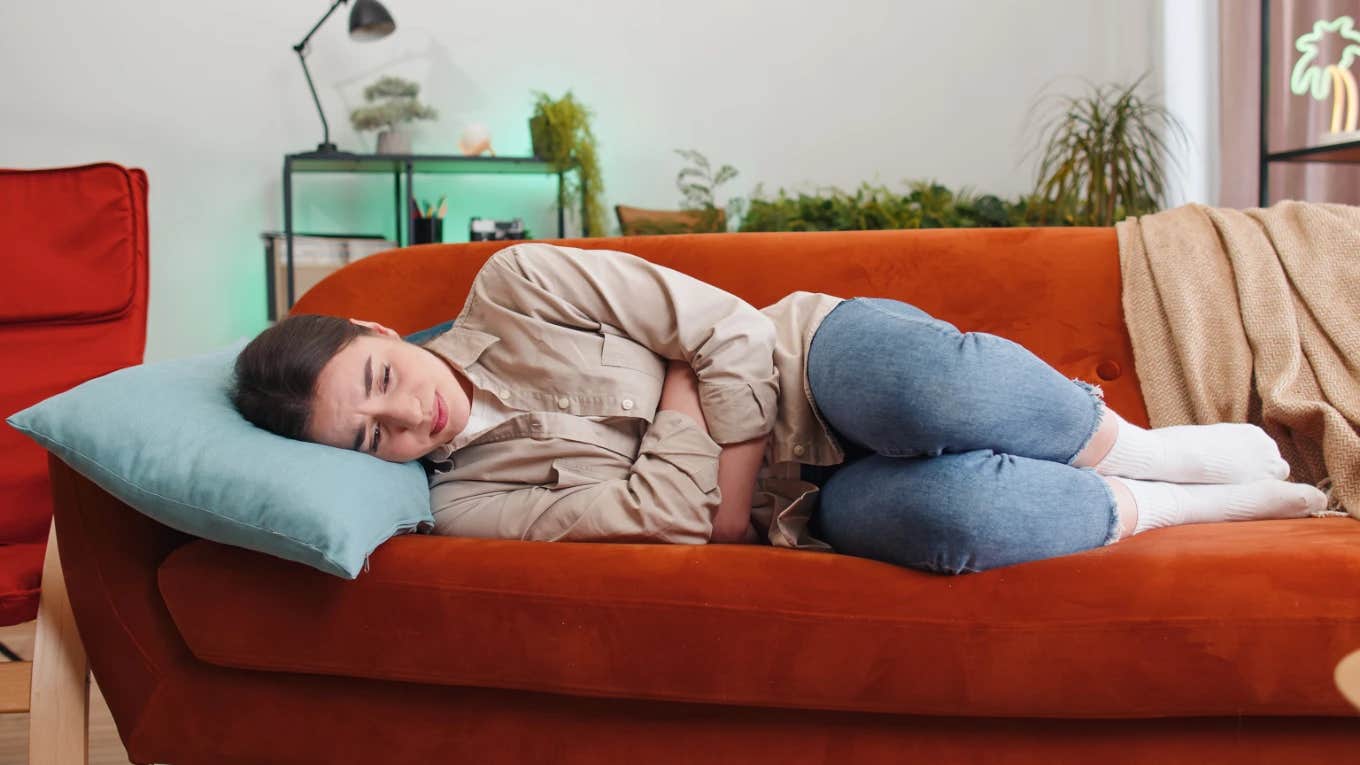 Woman Says That Her Girlfriend Is Mad At Her For Taking 2 Days Off Of Work Because Of 'Period Cramps' Woman at home and in pain because of period cramps