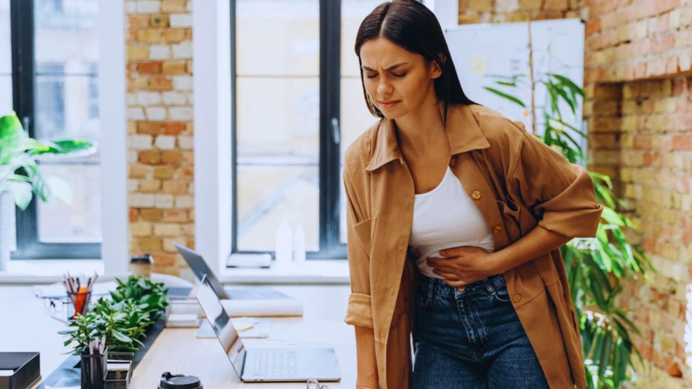 Husband Doesn’t Understand Why His Wife Won’t Call Out Of Work During Her Painful Periods woman having cramps at work
