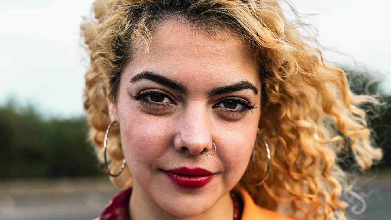 Types Of Women Who Make Very Bad Partners serious woman with yellow orange hair