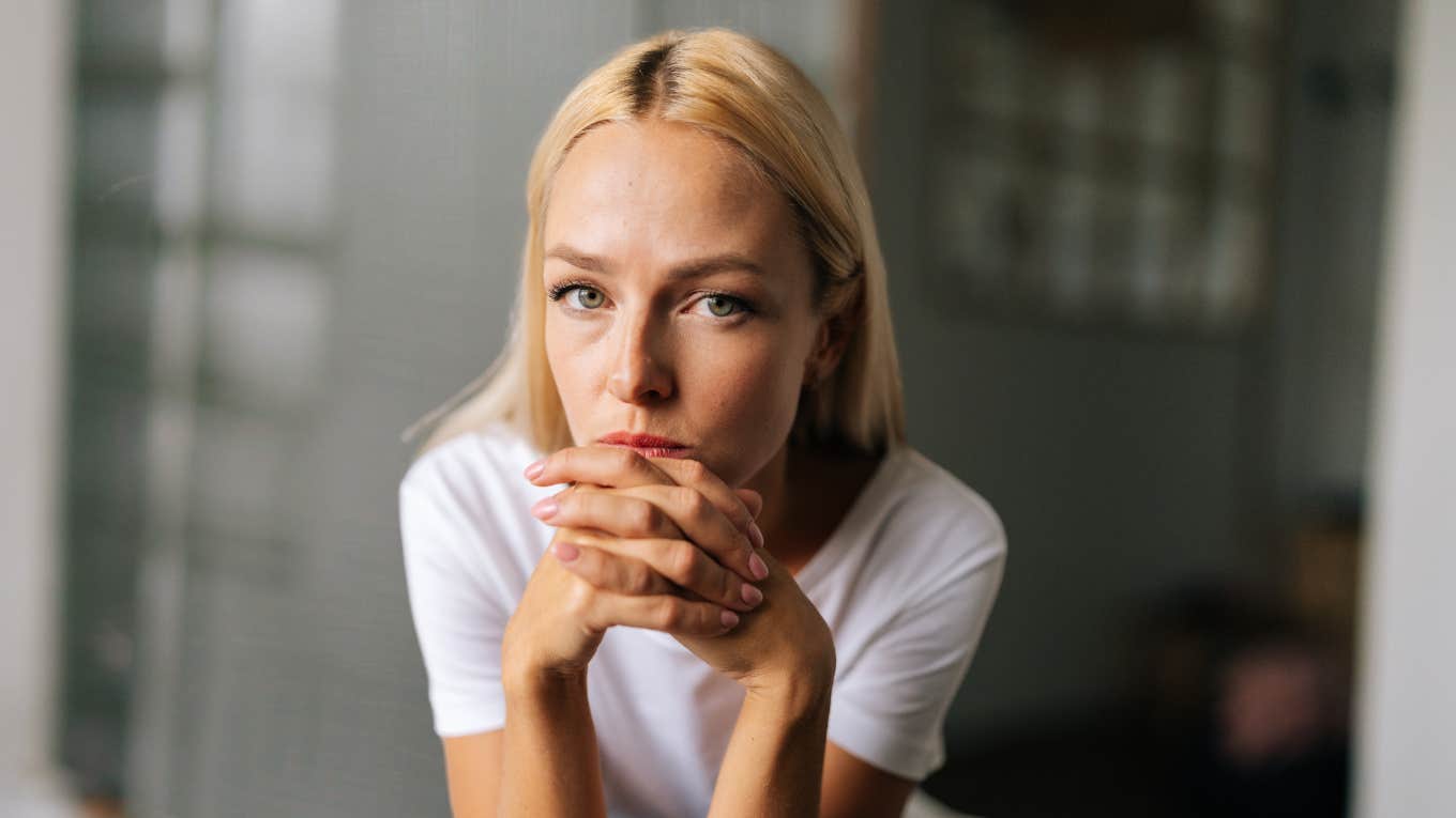 Sign you're in a relationship with a narcissist Woman looking serious, experiencing effects of relationship with narcissist