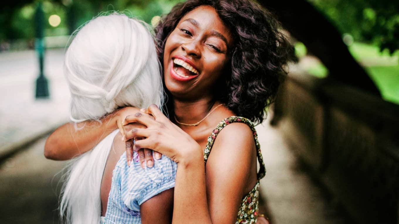 Healthy Habits People Fun Lives Lots Friends Joyful Black woman with a fun life hugging a friend