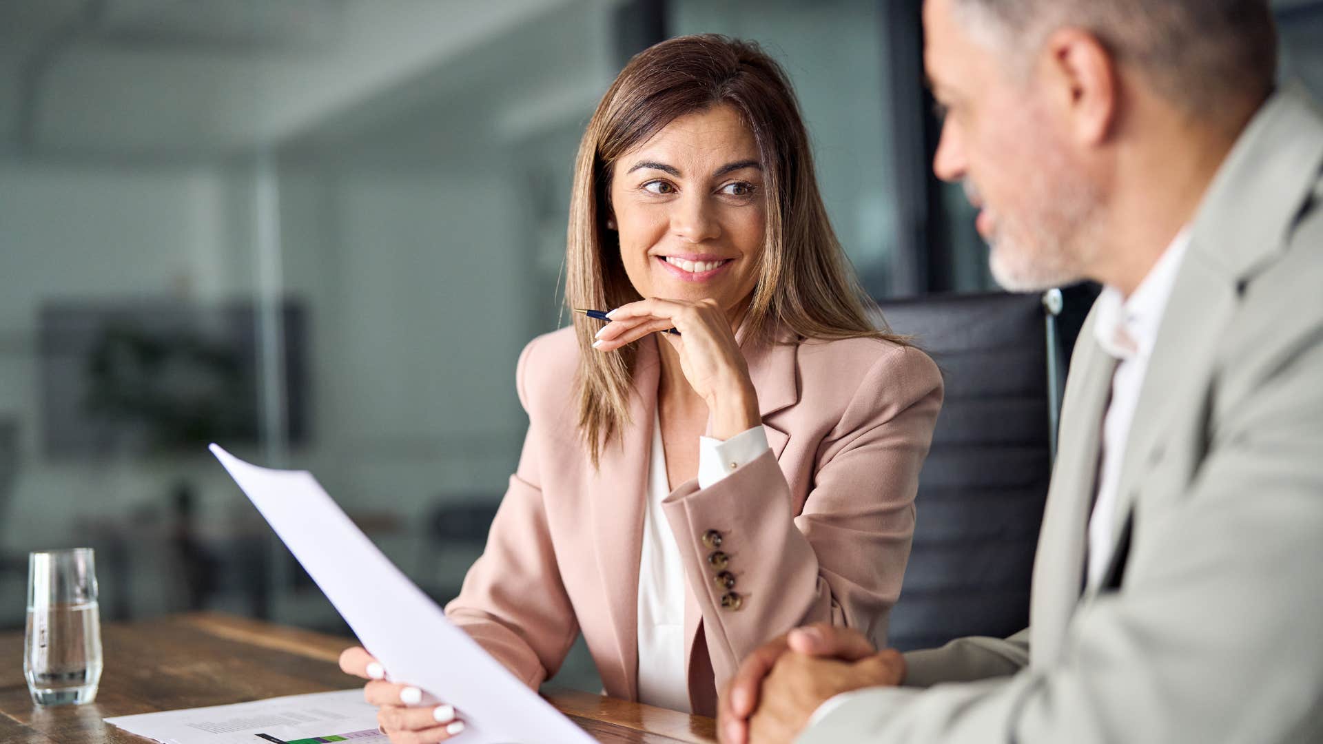 professional woman accepting feedback from boss