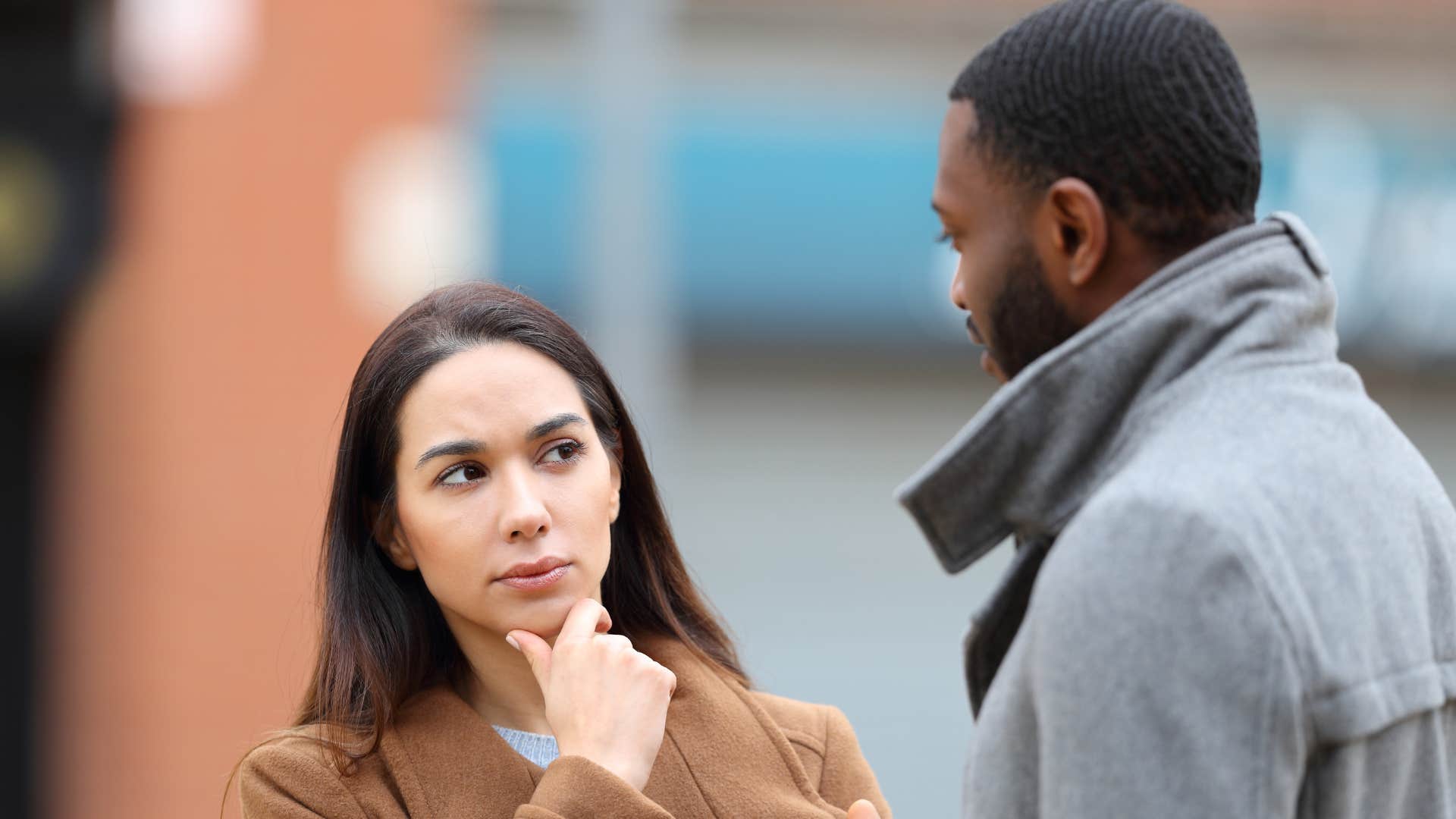 a woman pauses before responding to her date