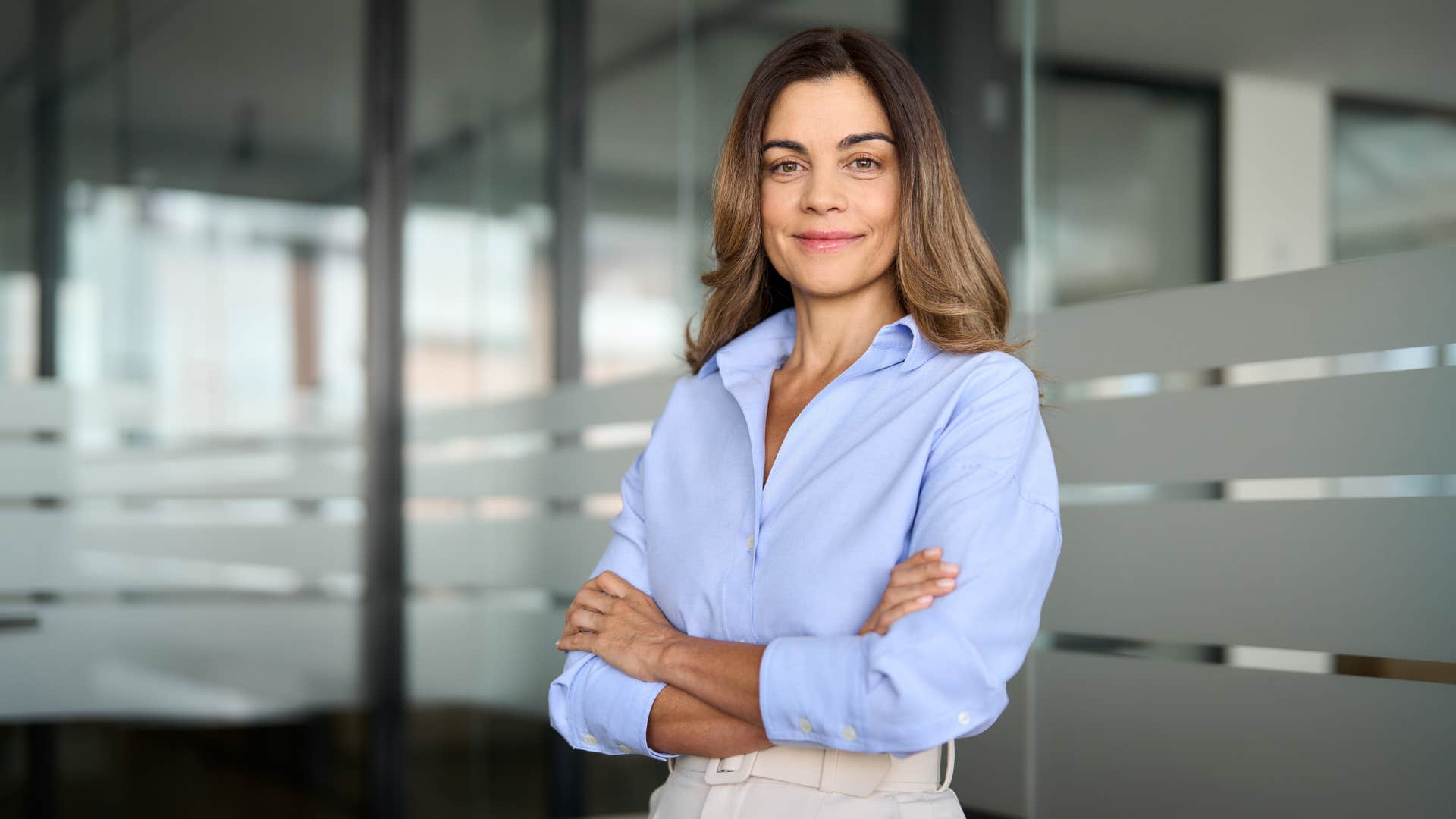 confident businesswoman with her arms crossed