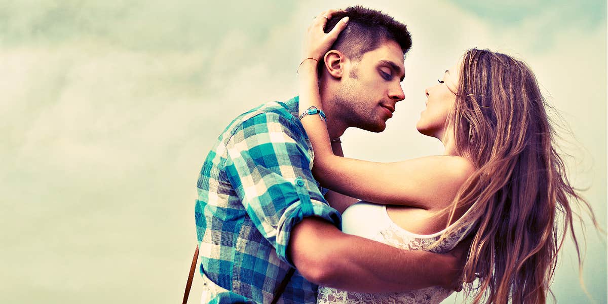 how to know if your love is doomed or it's just a stage man trying to kiss a woman in front of a dramatic could sky