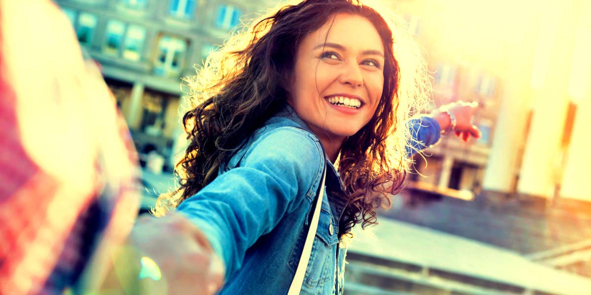 How Long After A Breakup To Wait Before Dating Again woman excited to be dating again after a breakup