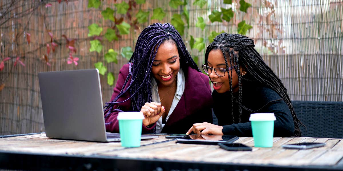 Mentor skills African-American Woman works with younger woman
