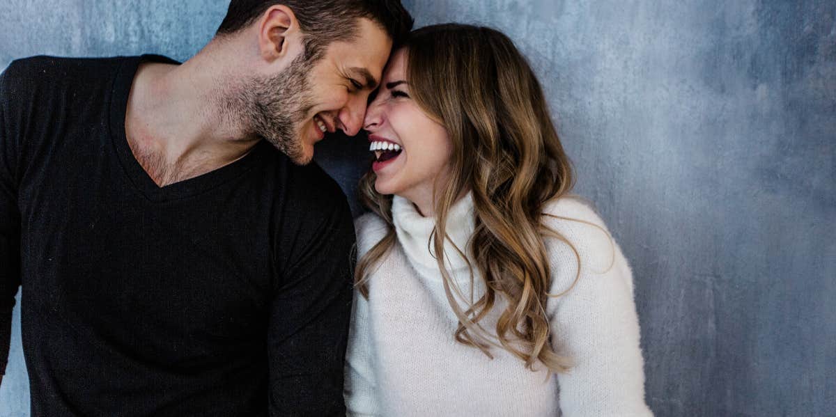 Signs A Man Is Falling In Love With You man looking at woman he is falling in love with smiling