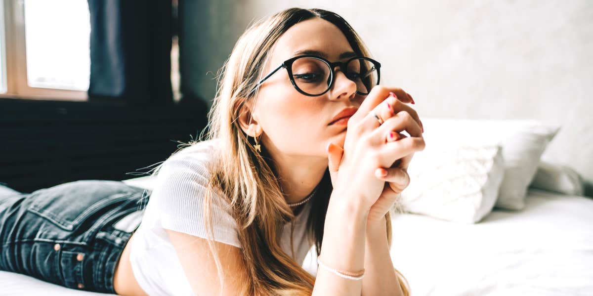 11 Things To Do When You Just Can't Stop Thinking About Him woman thinking on bed
