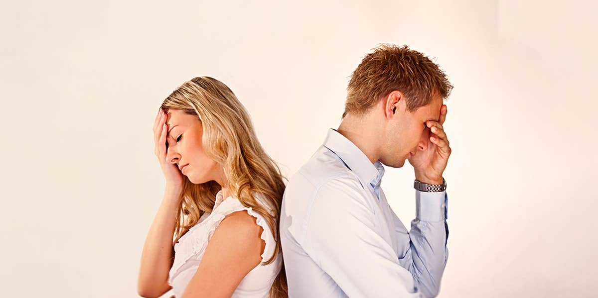 If You Keep This Secret From Your Spouse, Your Marriage Will Crumble couple facing at opposite direction looking nervously