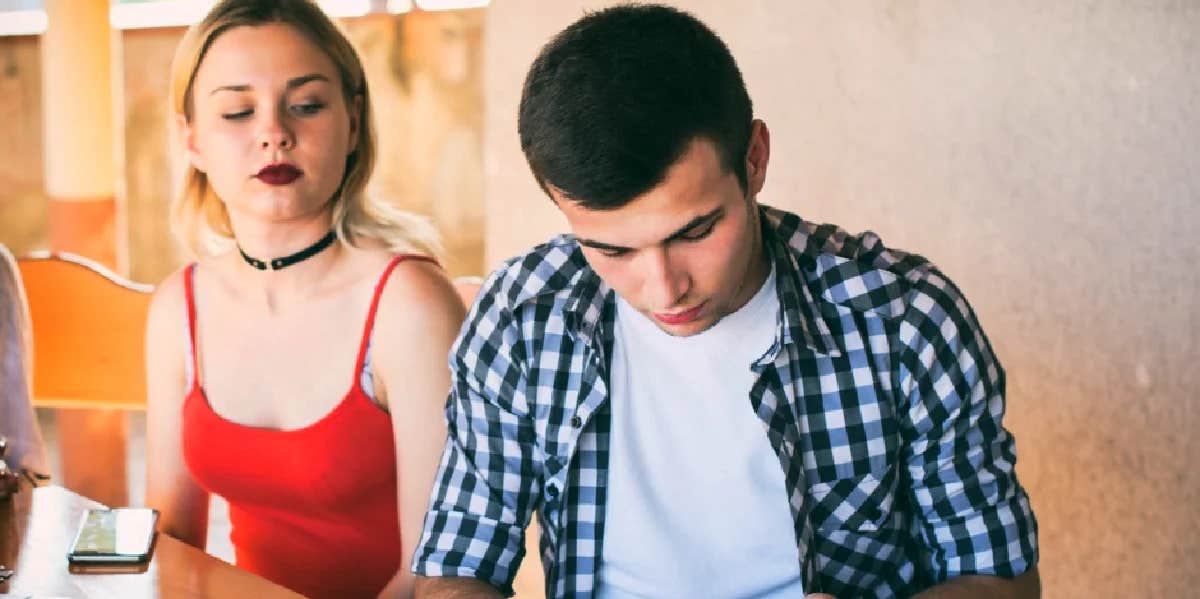 Why Men Pull Away And How To Make it Stop woman sitting next to man who is pulling away