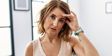 extremely tired woman trying to stay awake